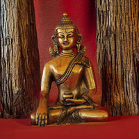 buddha statue in red fabric